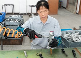 a worker assembling brake parts' components