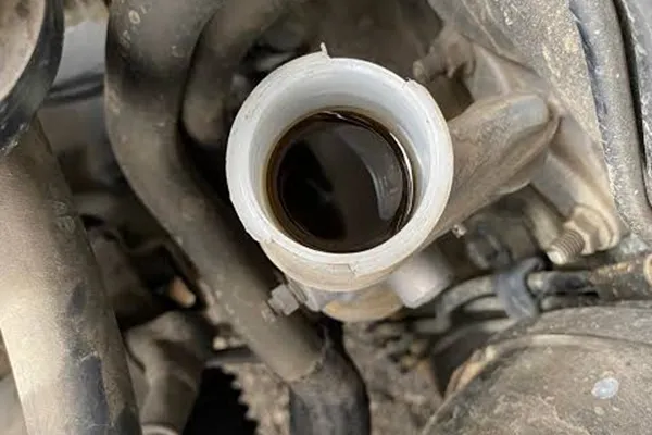 worn clutch master cylinder seal and dark contaminated hydraulic fluid